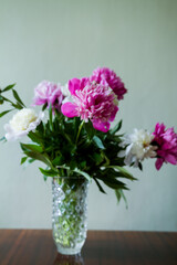 bouquet of flowers in vase. bouquet of white and pink peonies in a vase.