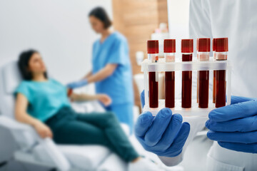 Blood test for allergies. Nurse taking blood for allergen testing by collecting blood in test tubes...