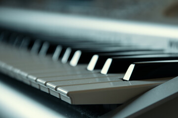 Synthesizer keys close-up, selective focus, side view