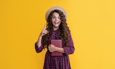 inspired with idea kid with frizz hair hold book on yellow background
