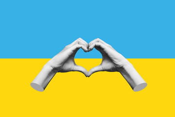 Human female hands showing a heart shape isolated on a background of the Ukrainian flag. Feelings...