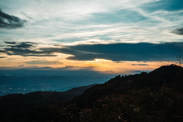 The view from the top of the mountain at sunset, taken from a bird's eye view