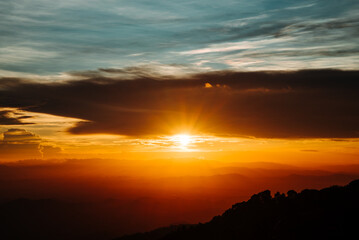The view from the top of the mountain at sunset, taken from a bird's eye view