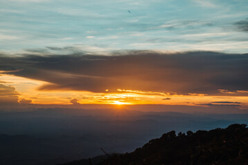 The view from the top of the mountain at sunset, taken from a bird's eye view