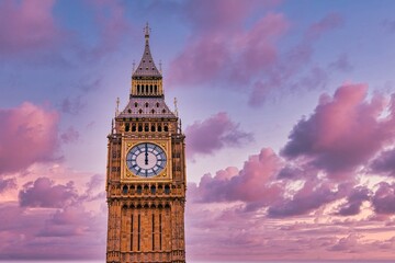 Big Ben, London, UK. A view of the popular London landmark, the clock tower known as Big Ben against a pink and cloudy sky. Special art filter. High quality photo