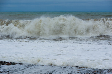 Stormy sea waves breaking near the coast