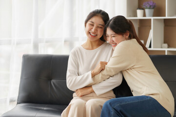 Obraz na płótnie Canvas Asian lesbian couple, LGBTQ. Happy Two young Asia women showing love and romance together at home. Positive mood and moment of LGBT lesbian.