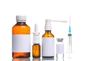 Medication products bottles with blank labels and syringe isolated on white background with...