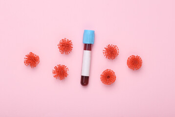 Blood test bottle with label for information and virus molecule on pink background