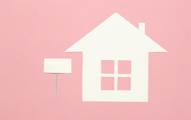 Fototapeta na wymiar House for sale. Paper house with blank sign on pink background