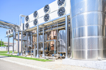 Wine steel tanks, equipment of contemporary winemaker factory.  Barrels for wine storage.