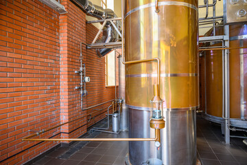 Wine steel tanks, equipment of contemporary winemaker factory.  Barrels for wine storage. Equipment...