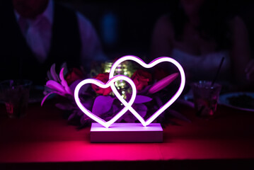 Neon hearts with purple and pink accents