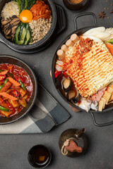 Bibimbap Mixed rice, Jjamppong Korean noodle soup with gochutgaru chili powder, Tteok-bokki Stir-fried rice cakes, Combo Set of Korean food concept.