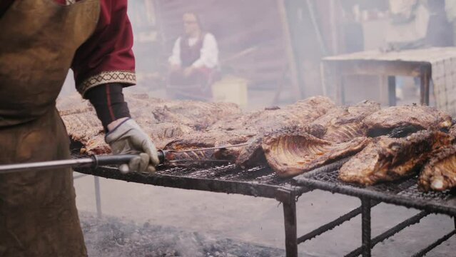 Traditional medieval barbecue ribs, grill BBQ medieval style, fried meat food.