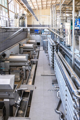 Wine steel tanks, equipment of contemporary winemaker factory.  Barrels for wine storage. Equipment for the fermentation, distillation of alcohol. Preparation workshop for pure alcohols.