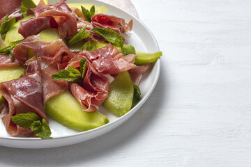 Fresh serrano ham salad with cantaloupe melon