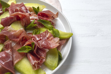 Fresh serrano ham salad with cantaloupe melon