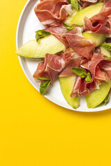 Fresh serrano ham salad with cantaloupe melon