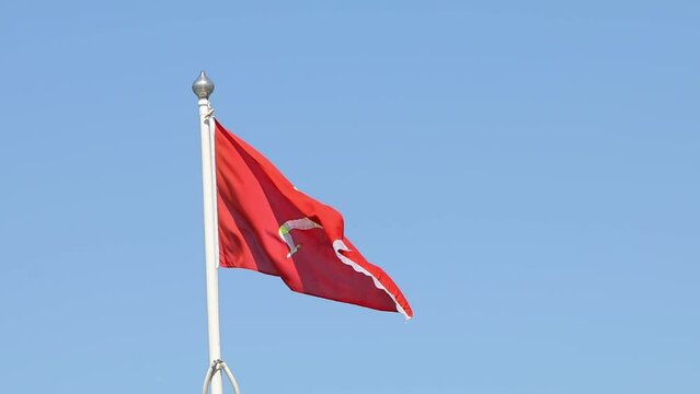 Manx flag flying on a pole. Douglas, Isle of Man