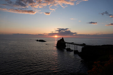 Early summer in Biarritz, France. Beach, Surfing holidays. Lighthouse, clouds, Ocean, Biscay, Sunset, Rainbows