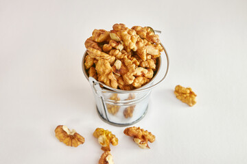 Walnuts in a metal mini-bucket.