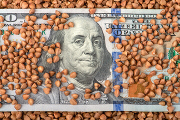 Buckwheat prices. World food crisis. Financial derivatives market. One hundred dollar bill in...