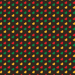 Seamless pattern with hearts in traditional Pan African colors - red, yellow, green on brown background. Backdrop for Juneteenth, Kwanzaa, Black history month modern template.