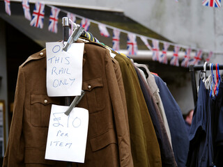 Vintage market sale with clothes hung on a rail