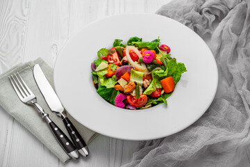 Salad with seafood and fresh vegetables. Healthy salad plate.