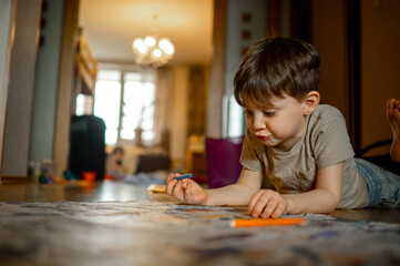 boys draw with colored pencils