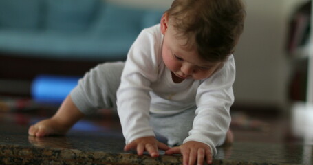 baby climbing down home step, infant development