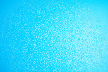 Water Drops On Blue Background.