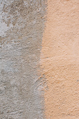 Background, texture of a cracked, stained beige, gray old wall.