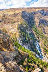 Frozen water in the waterfall in mountain of Altai Republic. Siberia, Russia