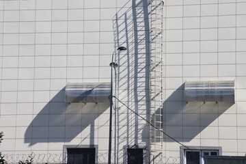 View of the exterior of the store building with the fire escape.