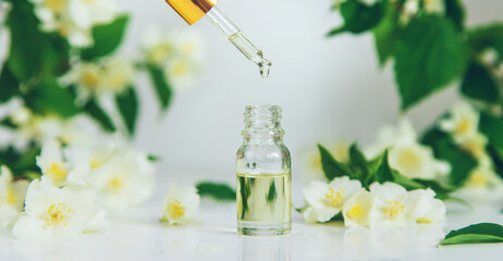 Spa salon background jasmine oil. Selective focus.