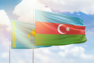 Sunny blue sky and flags of azerbaijan and kazakhstan