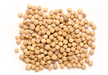 White pepper, spice close-up flat lay on a white background. Indian and Arabic spices for cooking. Medicinal herbs and spices.