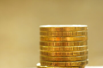 A stack of coins in close-up. Background image. Economics and finance.
