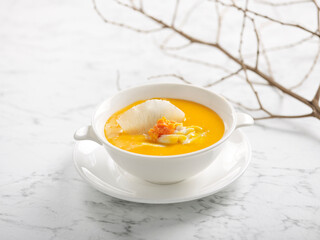 Braised Shark’s Fin Soup with Crab Roe served in a bowl isolated on grey background