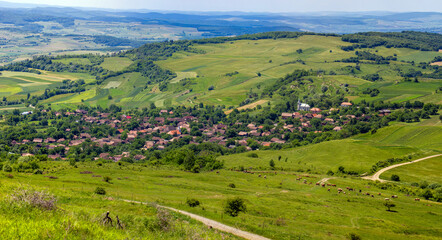 Naklejka premium Landscape with a village in a valley