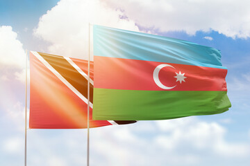 Sunny blue sky and flags of azerbaijan and trinidad and tobago