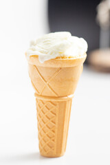 ice cream cone on white background and sugar particles on it