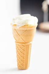 ice cream cone on white background and sugar particles on it
