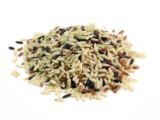 Pile of Organic rice close up. Mixed rice on white background. White, brown and black rice mixed together.