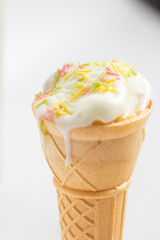 ice cream cone on white background and sugar particles on it