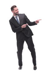 smiling handsome businessman pointing to copy space. isolated on white