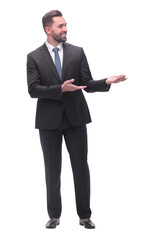 smiling handsome businessman pointing somewhere to the side. isolated on white