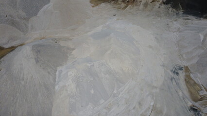 An aerial view of the piles of fine stone in the quarry. Fine stone is used in the production of quality asphalt for roads and for the preparation of concrete used in construction